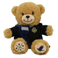 A plush teddy bear wearing a Ravenclaw robe and scarf, with screen printed details on its paw pads including the Ravenclaw eagle and the Hogwarts House cross logo.