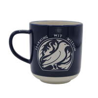A deep cobalt stoneware mug with white text and graphics, featuring the name 'Ravenclaw' and the image of an eagle, symbolizing the house's values of learning, wit, and wisdom.